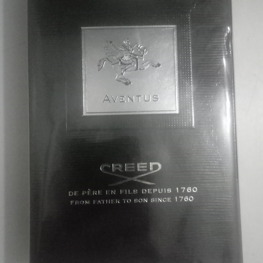 Creed Fragrance in Black and Silver Packaging